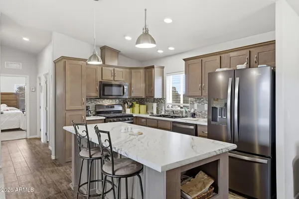 a dining room with a table and chairs