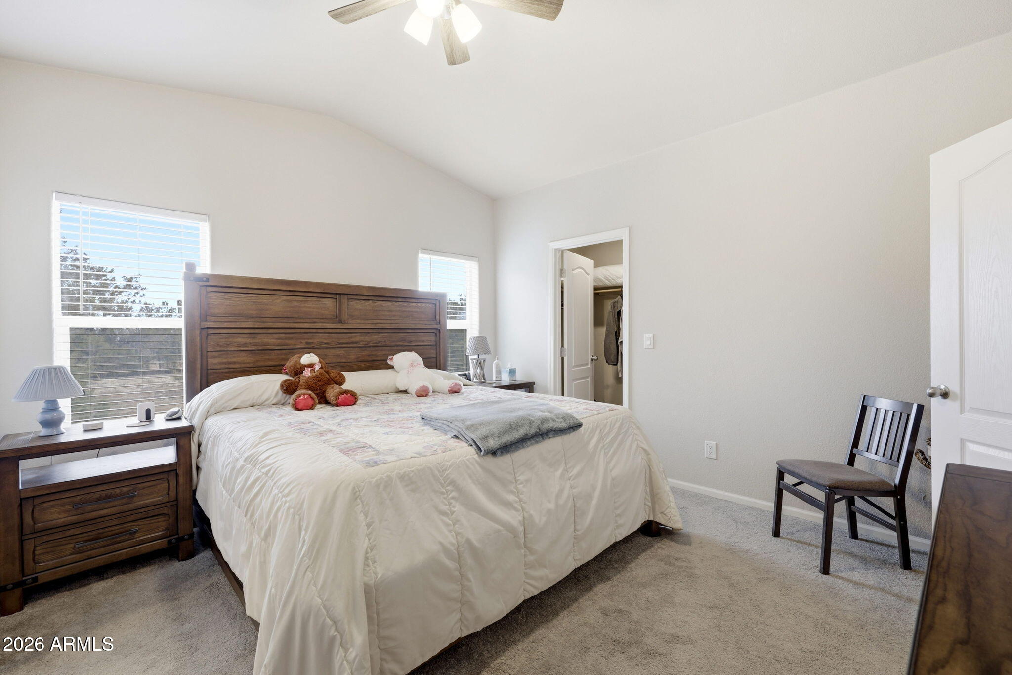 2145 Pulp Mill Road Clay Springs, AZ 85923 - Photo 14 of 33 a bedroom with a bed and a chandelier