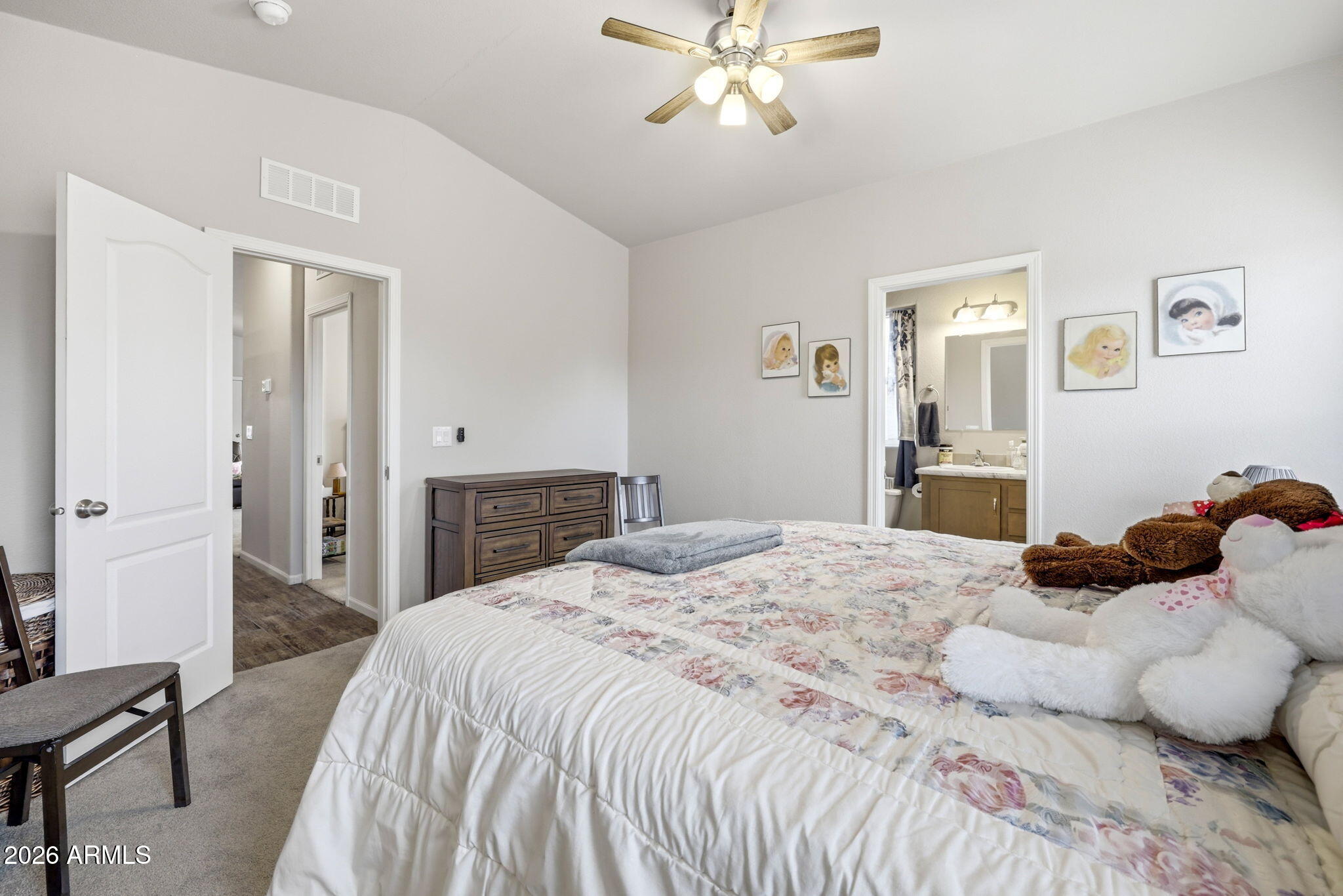 2145 Pulp Mill Road Clay Springs, AZ 85923 - Photo 15 of 33 a bedroom with a large bed and a chandelier