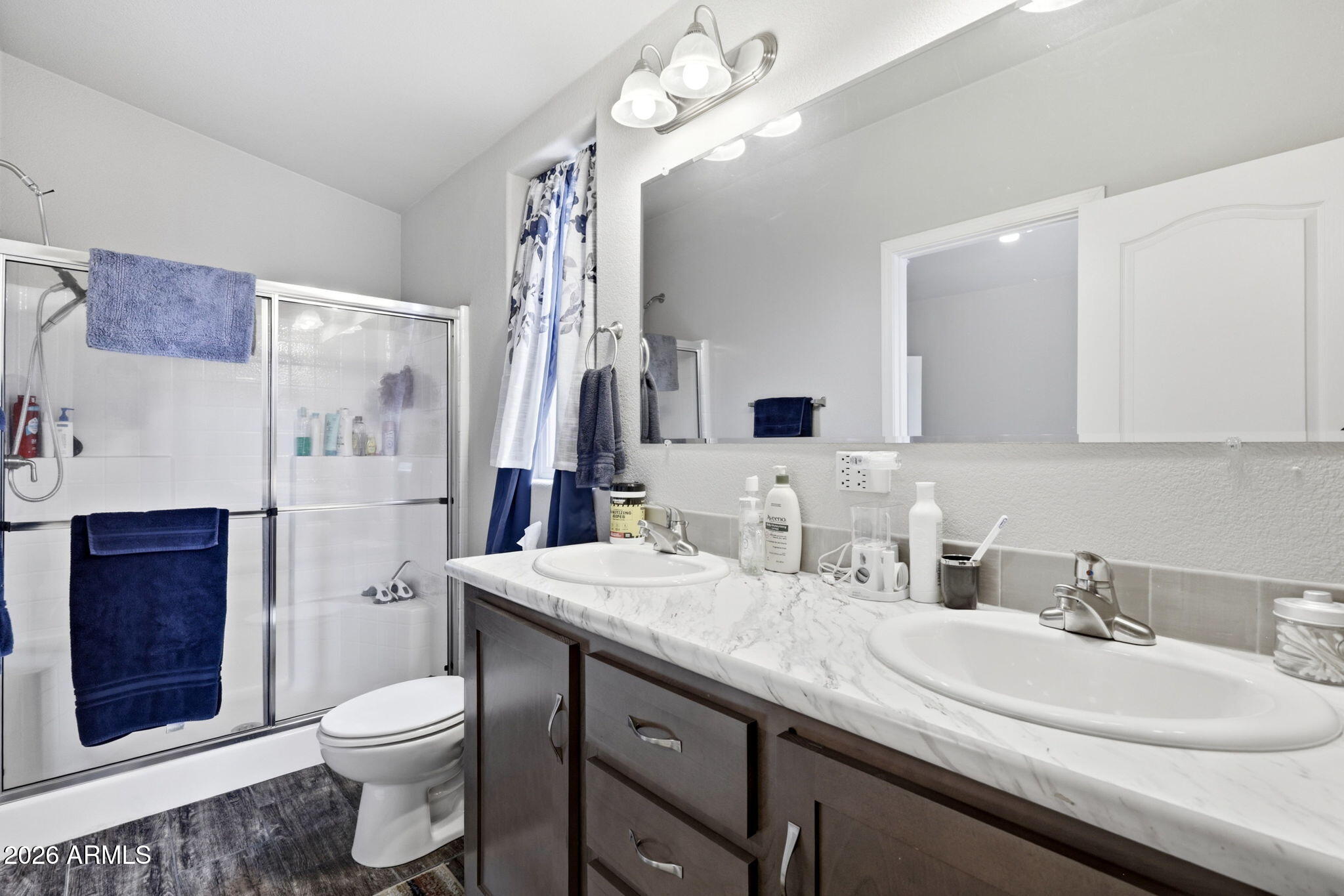 2145 Pulp Mill Road Clay Springs, AZ 85923 - Photo 16 of 33 a bathroom with a sink a toilet and shower