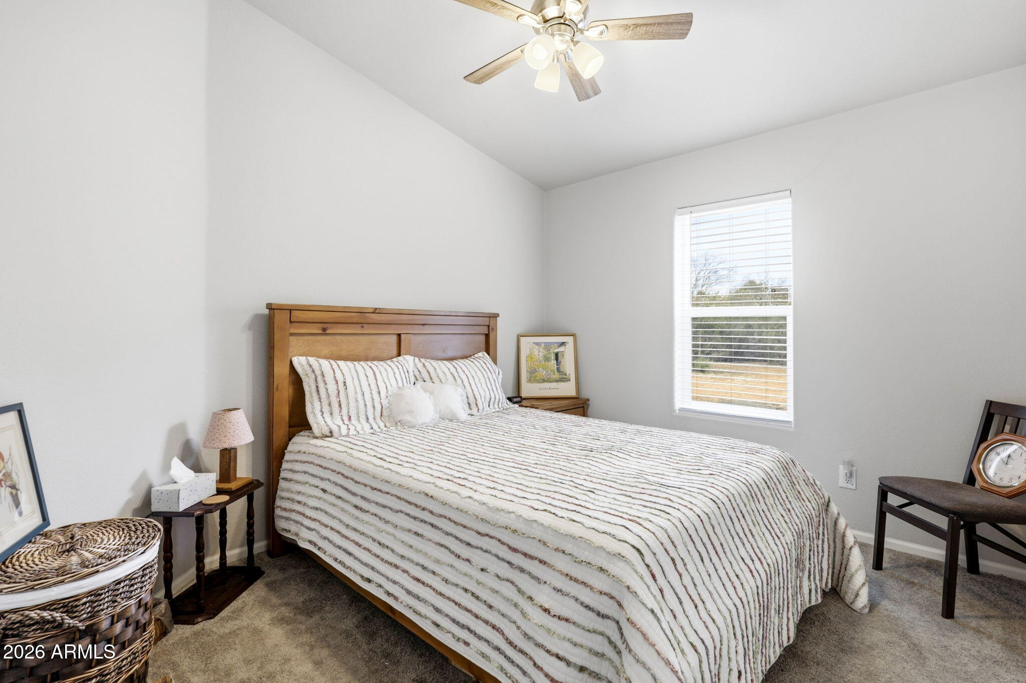 2145 Pulp Mill Road Clay Springs, AZ 85923 - Photo 17 of 33 a bedroom with a bed and a chandelier