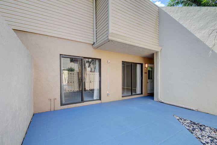 612 Executive Center Drive, Unit 103 West Palm Beach, FL 33401 - Photo 13 of 28 Fenced Patio