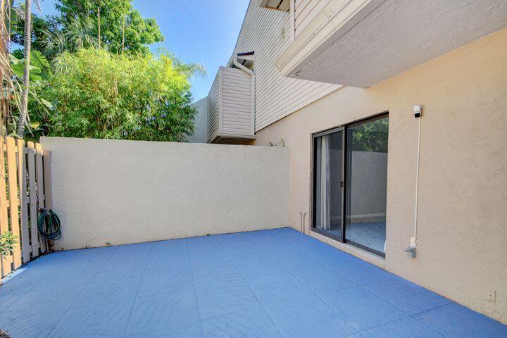 612 Executive Center Drive, Unit 103 West Palm Beach, FL 33401 - Photo 14 of 28 Fenced Patio