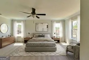 a bedroom with a large bed and a chandelier