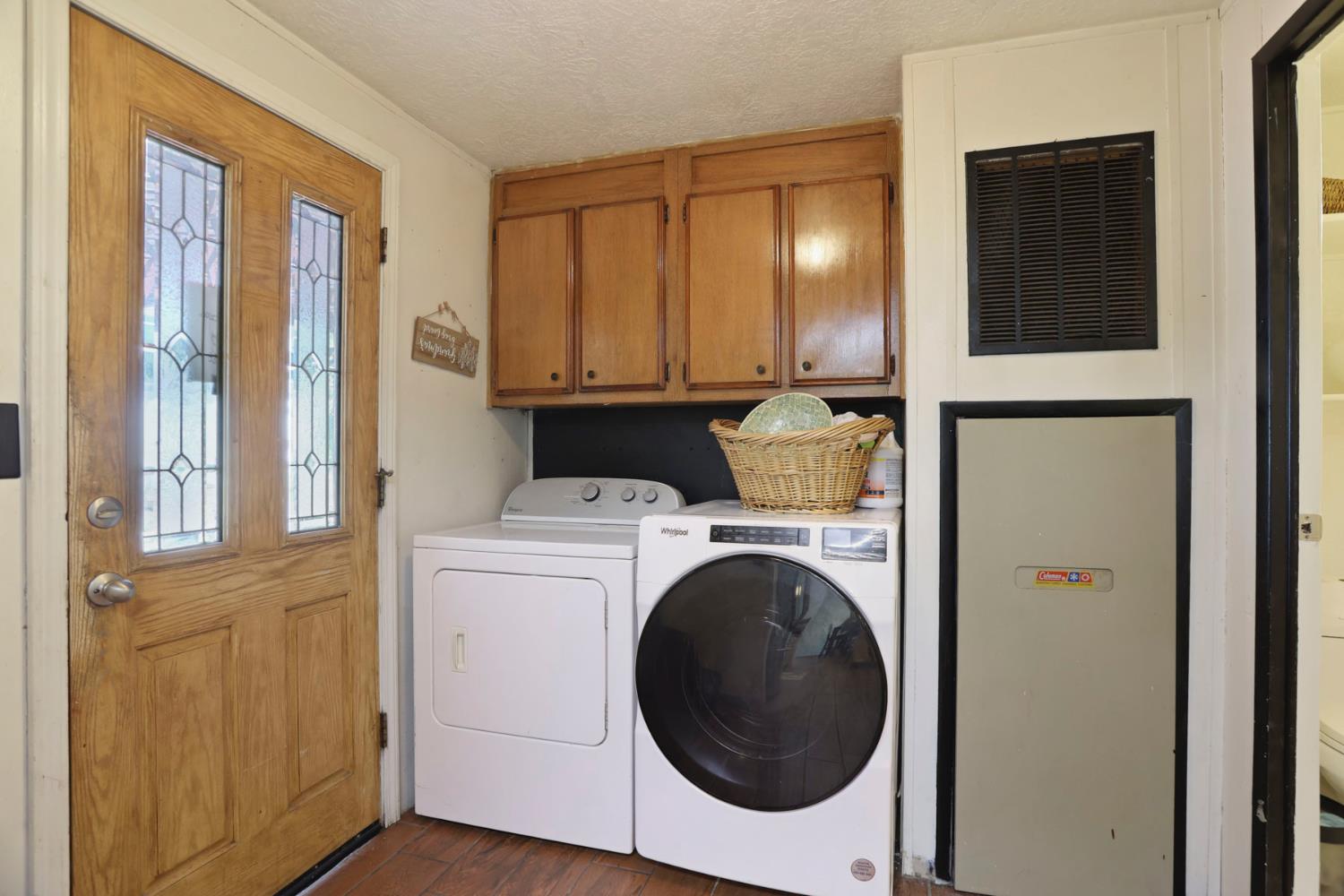 901 Quail Oaks Road Valley Springs, CA 95252 - Photo 29 of 59 a view of a storage and utility room with washer and dryer