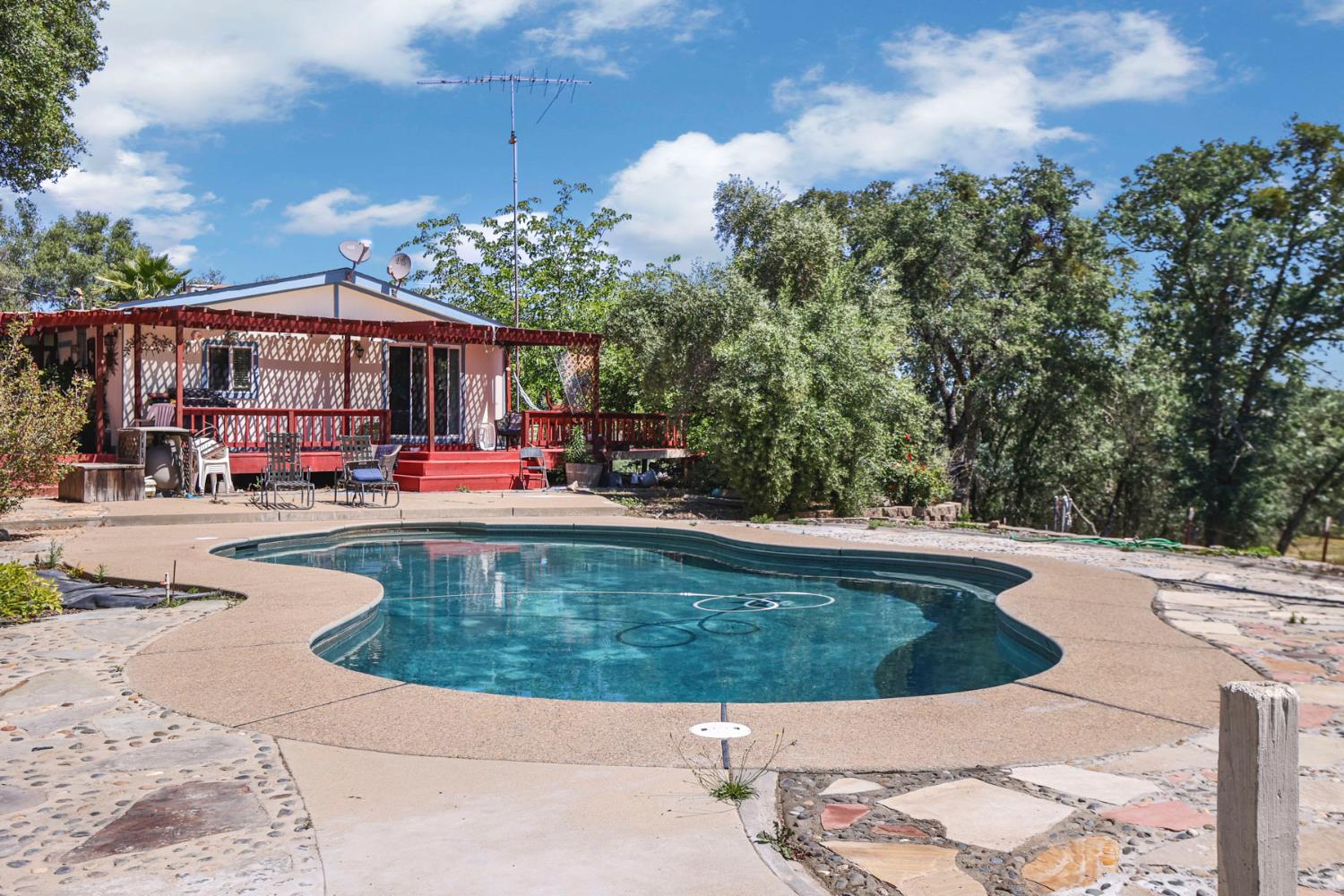 901 Quail Oaks Road Valley Springs, CA 95252 - Photo 35 of 59 a view of a swimming pool with a patio