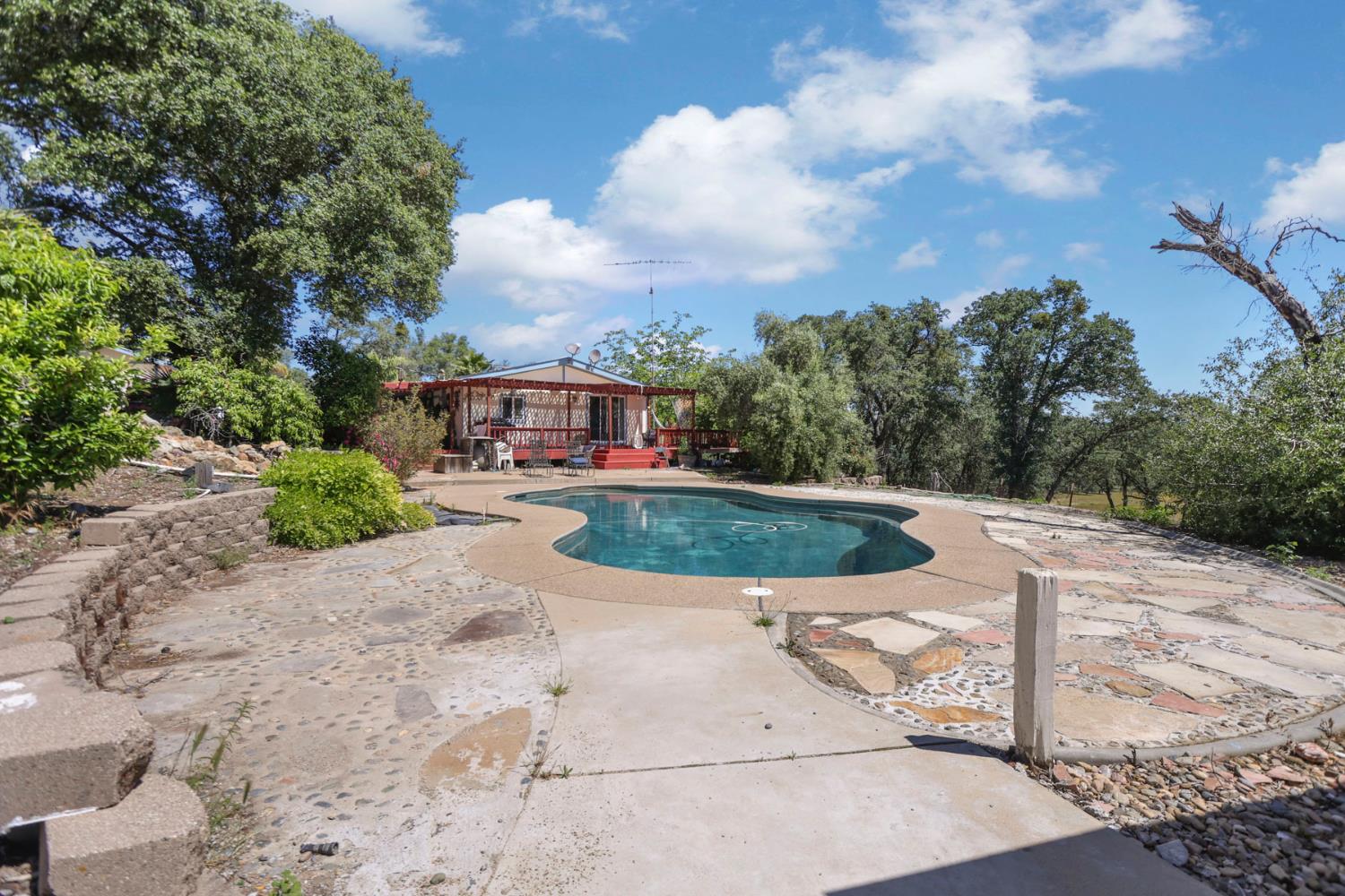 901 Quail Oaks Road Valley Springs, CA 95252 - Photo 38 of 59 a view of a lake with a house