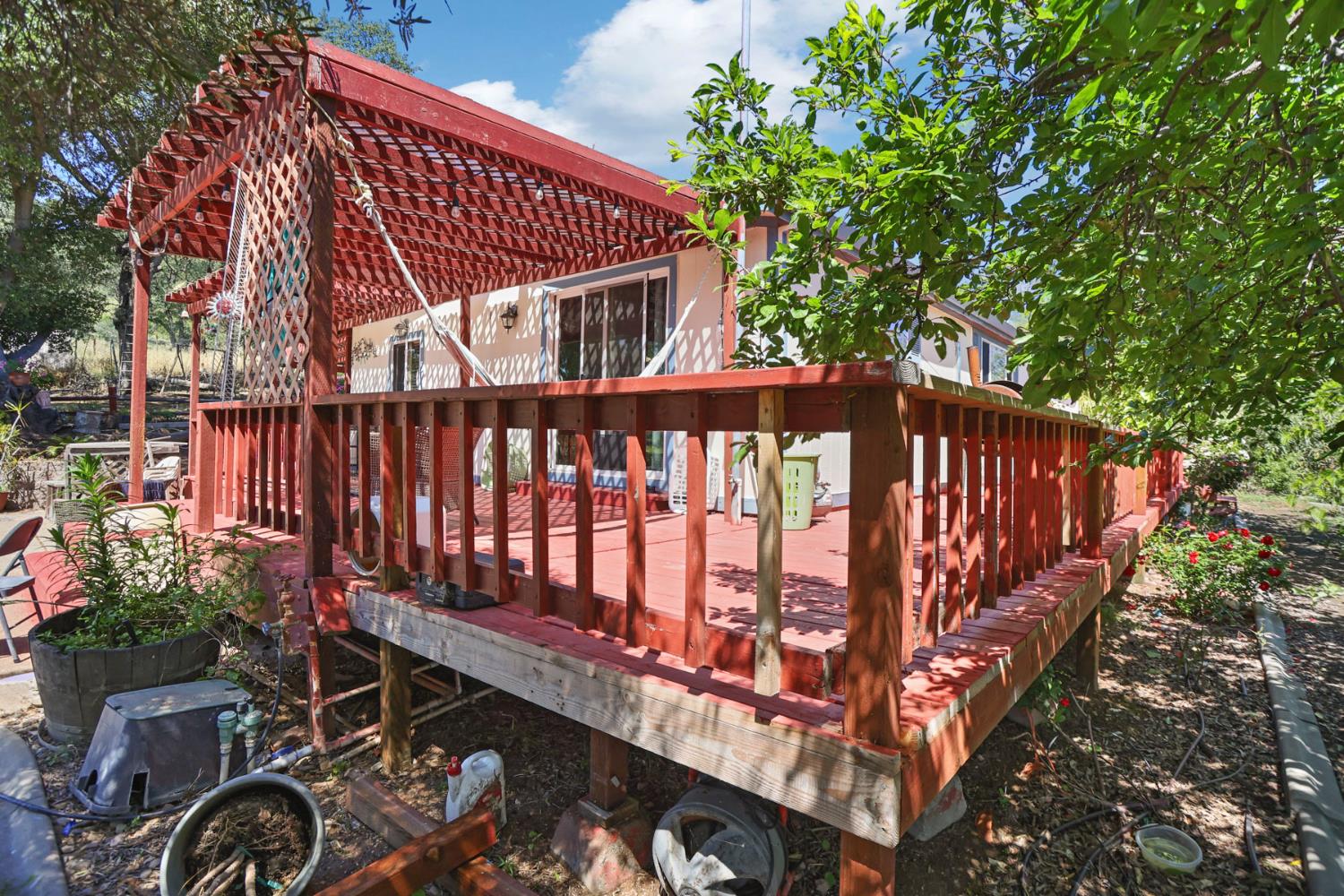 901 Quail Oaks Road Valley Springs, CA 95252 - Photo 47 of 59 a view of a wooden deck with a backyard