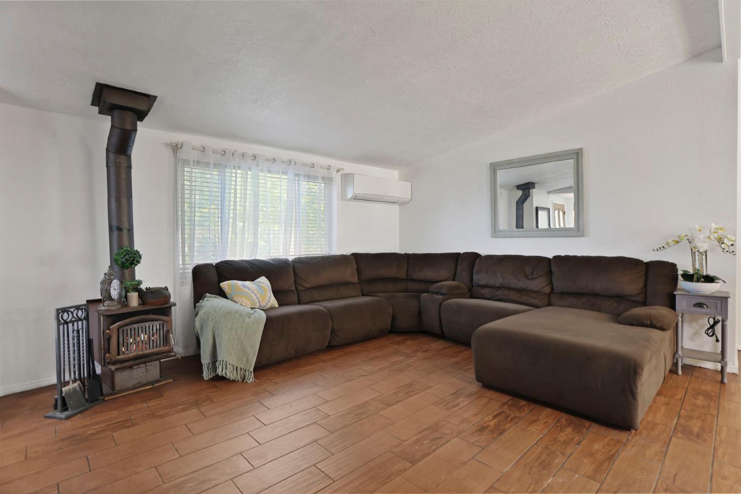 901 Quail Oaks Road Valley Springs, CA 95252 - Photo 7 of 59 a living room with furniture and a window
