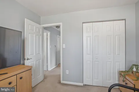 a view of a hallway with closet