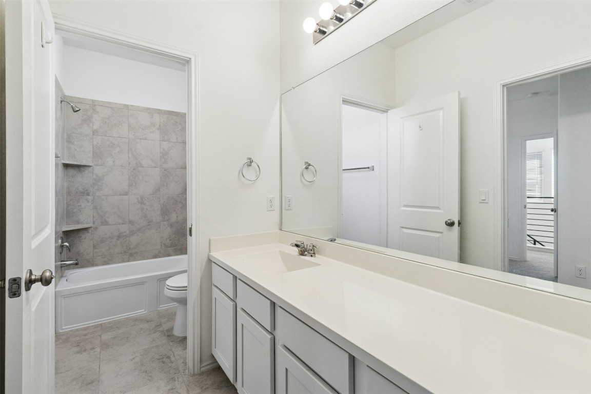 10405 Tree Duck Drive Austin, TX 78748 - Photo 22 of 33 Bathroom with vanity and shower / bath combination