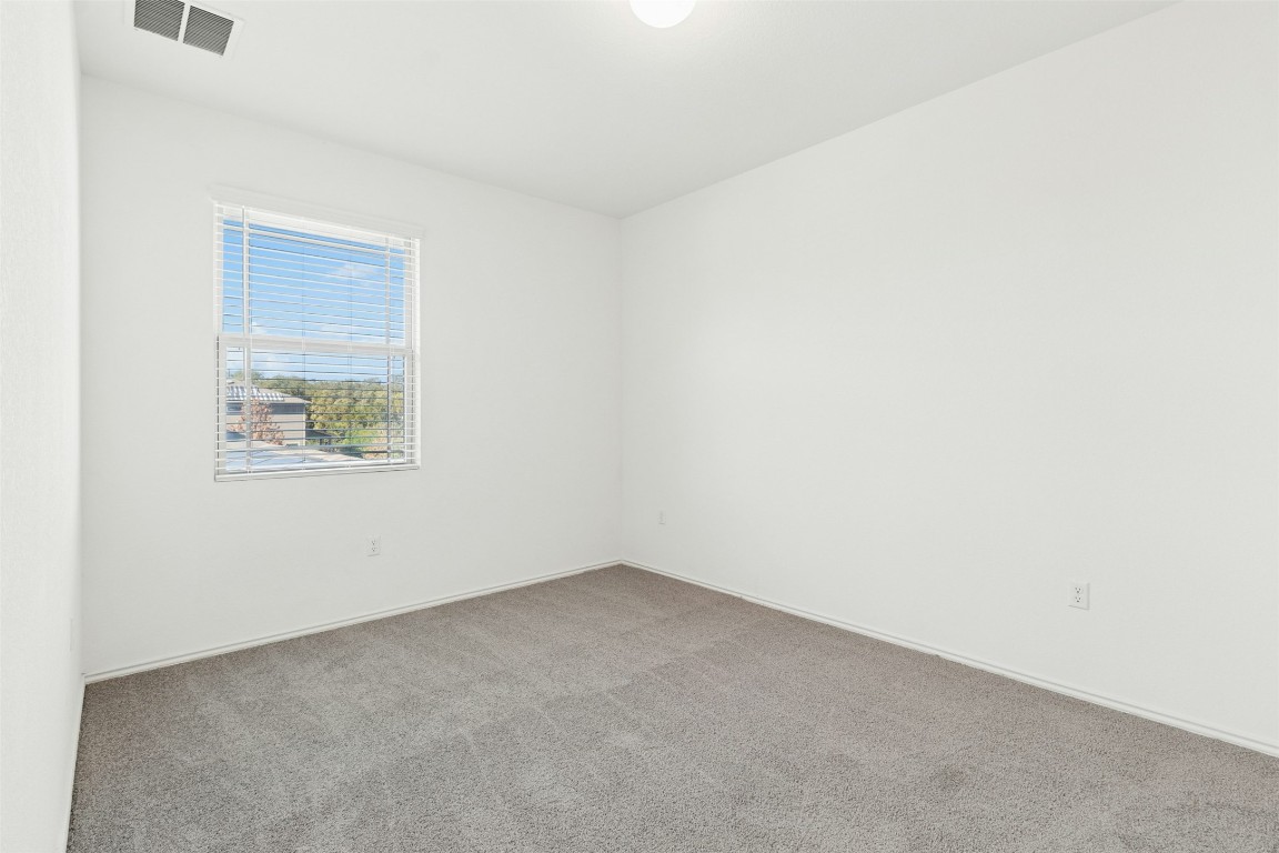10405 Tree Duck Drive Austin, TX 78748 - Photo 23 of 33 Carpeted empty room featuring baseboards