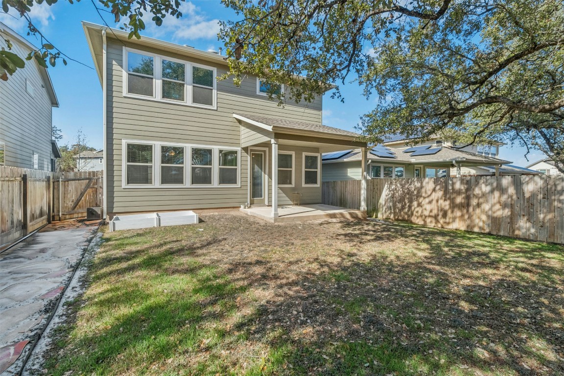 10405 Tree Duck Drive Austin, TX 78748 - Photo 29 of 33 Back of house featuring a patio area and a fenced backyard