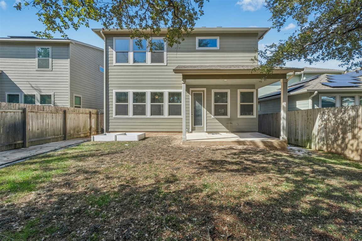 10405 Tree Duck Drive Austin, TX 78748 - Photo 30 of 33 Rear view of house featuring a patio and a fenced backyard