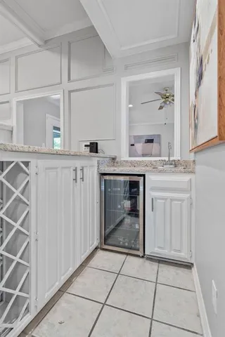 a kitchen with a stove sink and cabinets