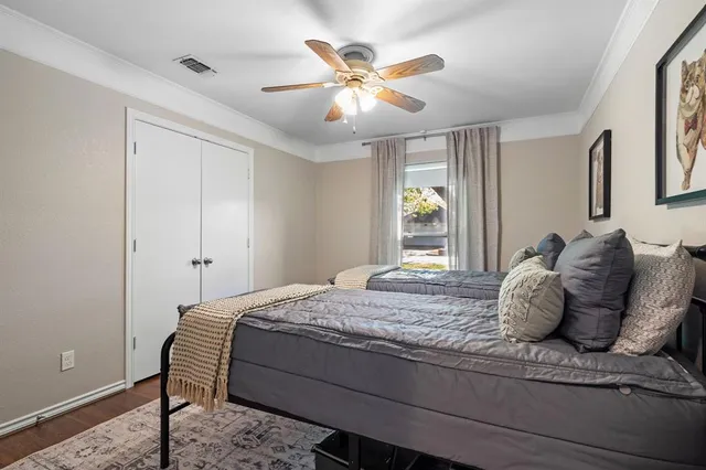 a bedroom with a bed and window