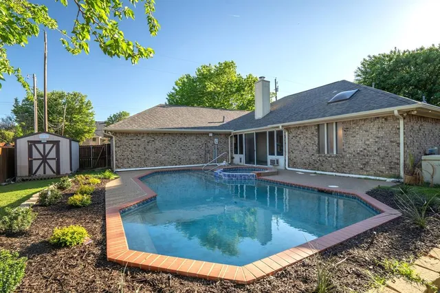 a view of a house with swimming pool