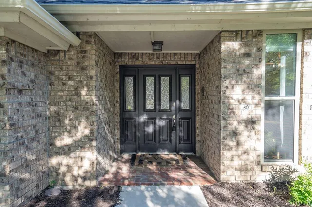 a front view of a house with a glass door