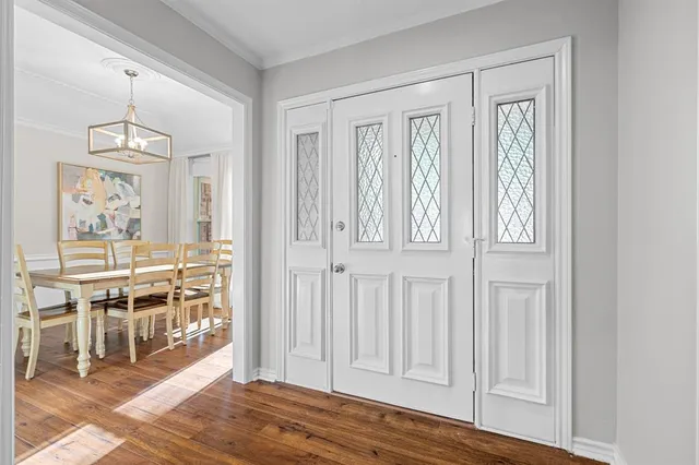 a view of a livingroom with furniture and wooden floor