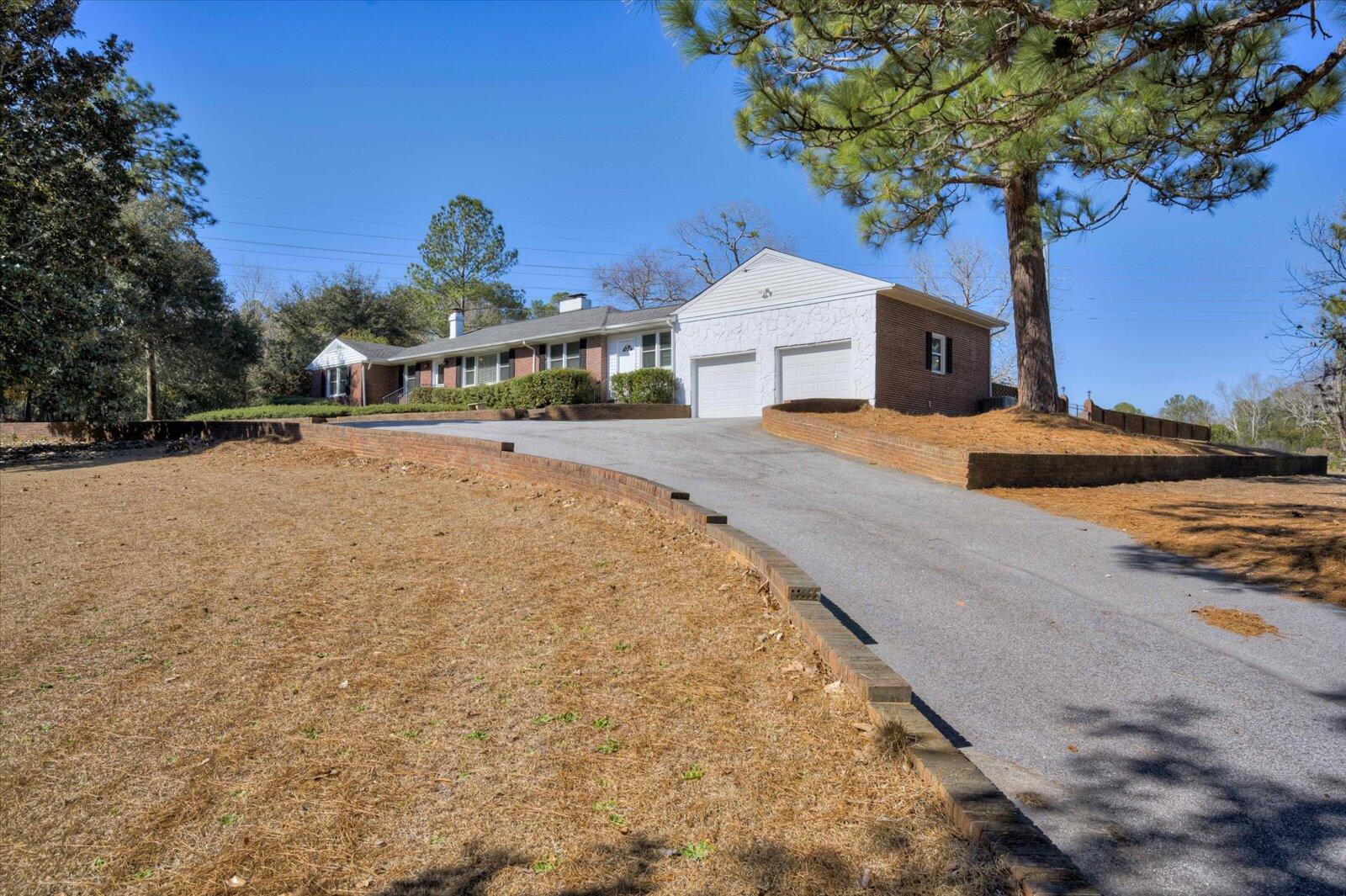2945 Wagener Road Aiken, SC 29801 - Photo 40 of 47 a front view of a house with a yard and garage