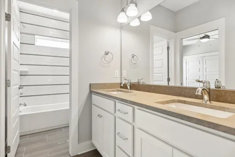 a bathroom with a sink a vanity and a mirror