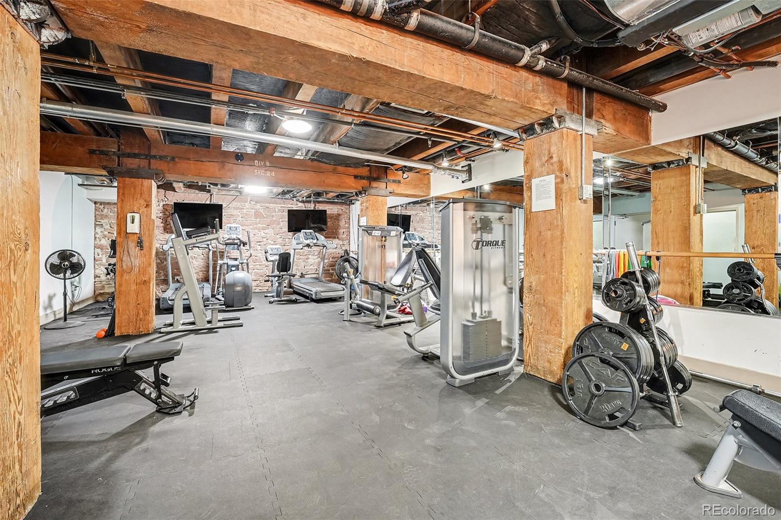 2960 Inca Street, Unit 103 Denver, CO 80202 - Photo 23 of 28 a view of a room with gym equipment
