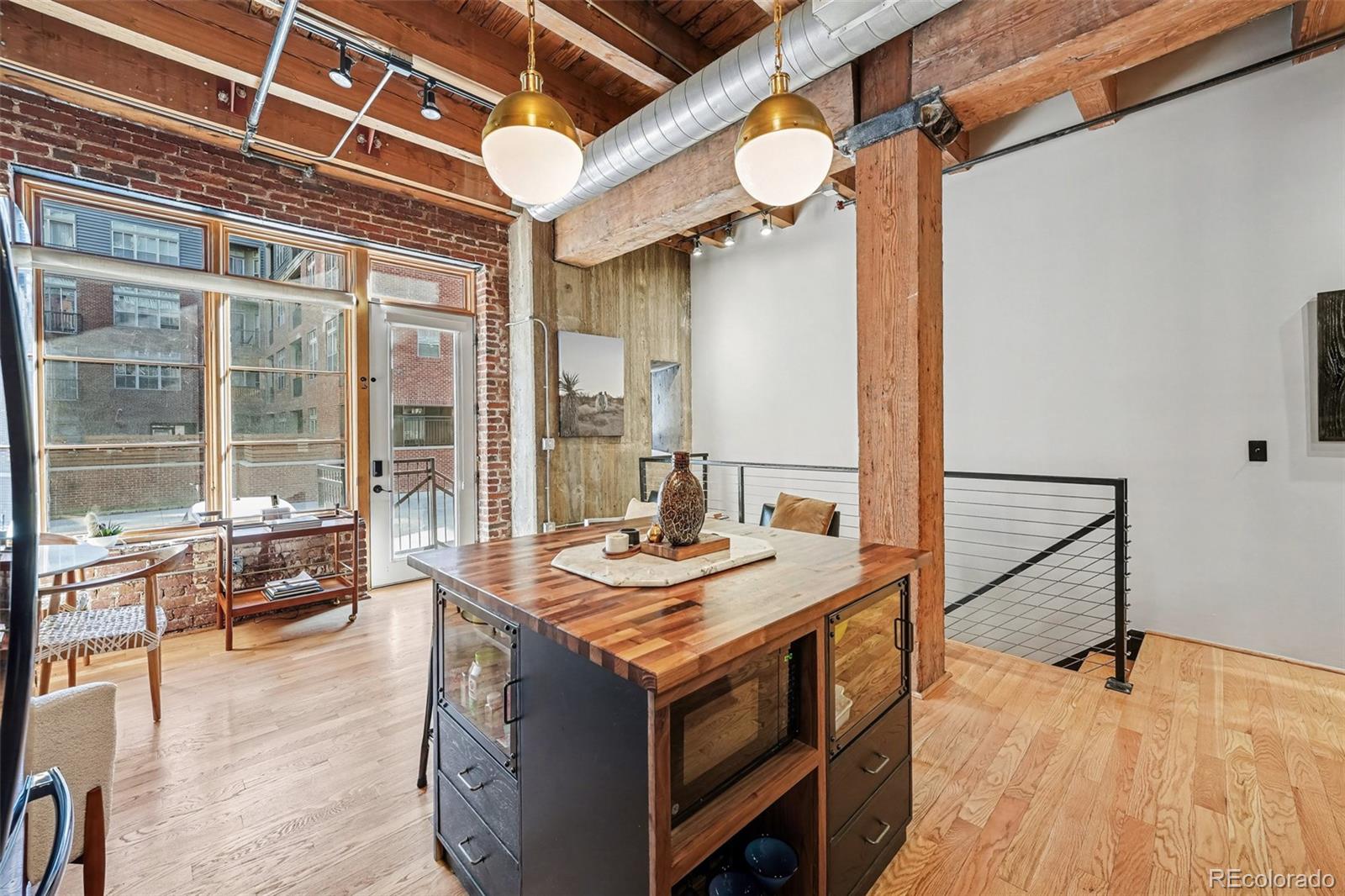 2960 Inca Street, Unit 103 Denver, CO 80202 - Photo 6 of 28 a view of a livingroom with furniture and window