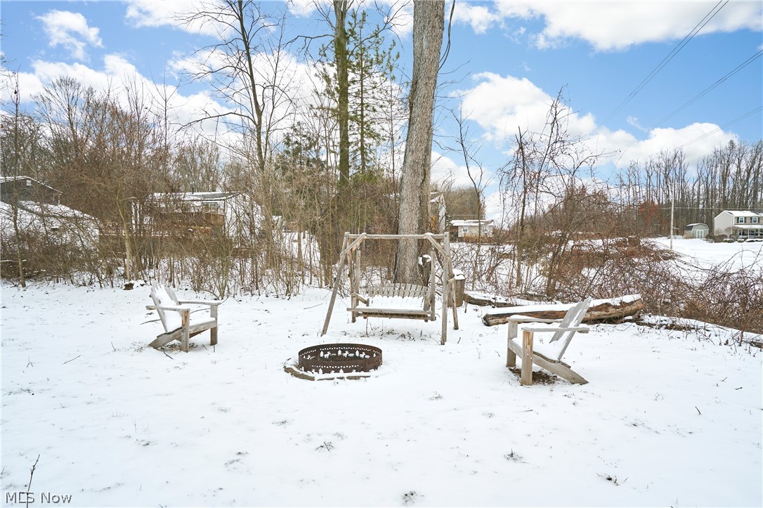 6300 South Cleveland Massillon Road Clinton, OH 44216 - Photo 20 of 22 View of yard with a fire pit