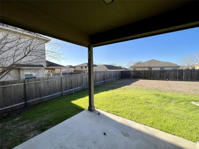 a view of a backyard with a small cabin