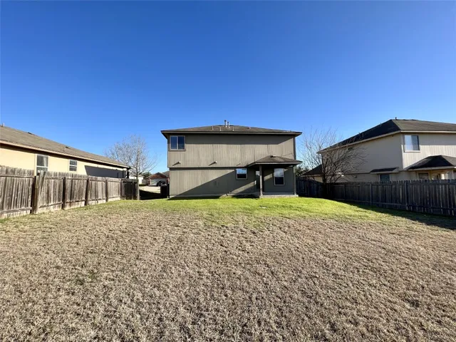a house view with a backyard space