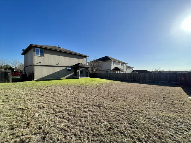 a house with trees in the background