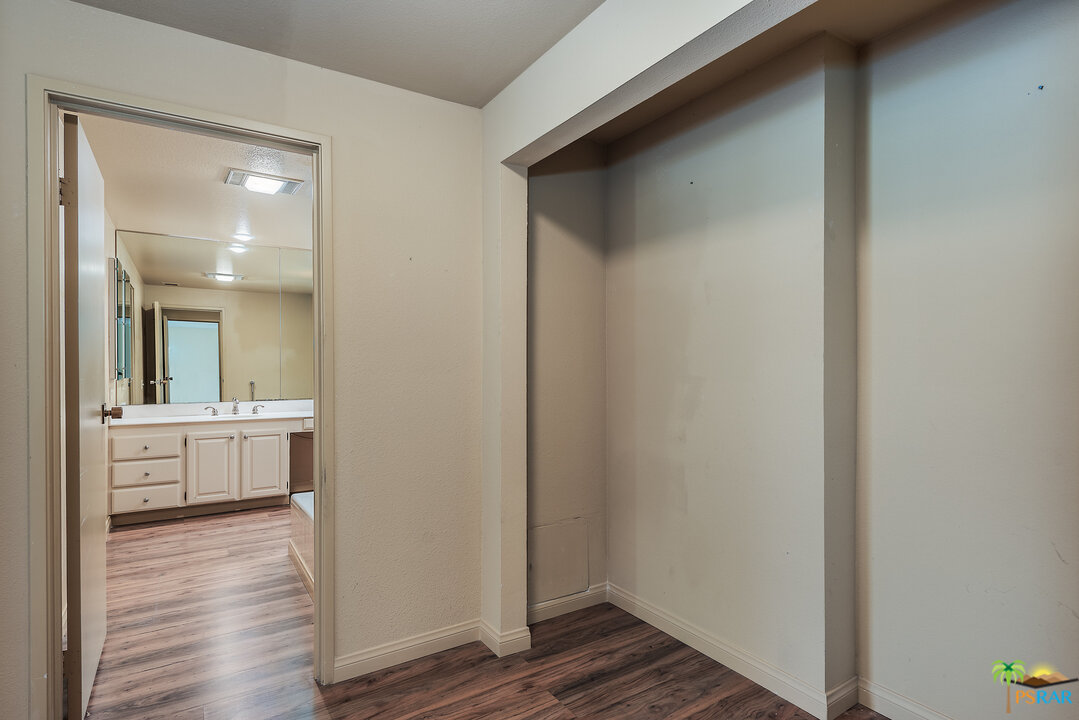 910 Island Drive, Unit 107 Rancho Mirage, CA 92270 - Photo 19 of 23 a view of dining room with wooden floor