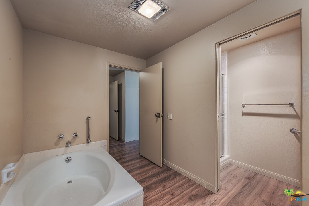 910 Island Drive, Unit 107 Rancho Mirage, CA 92270 - Photo 21 of 23 a white bath tub sitting in a bathroom