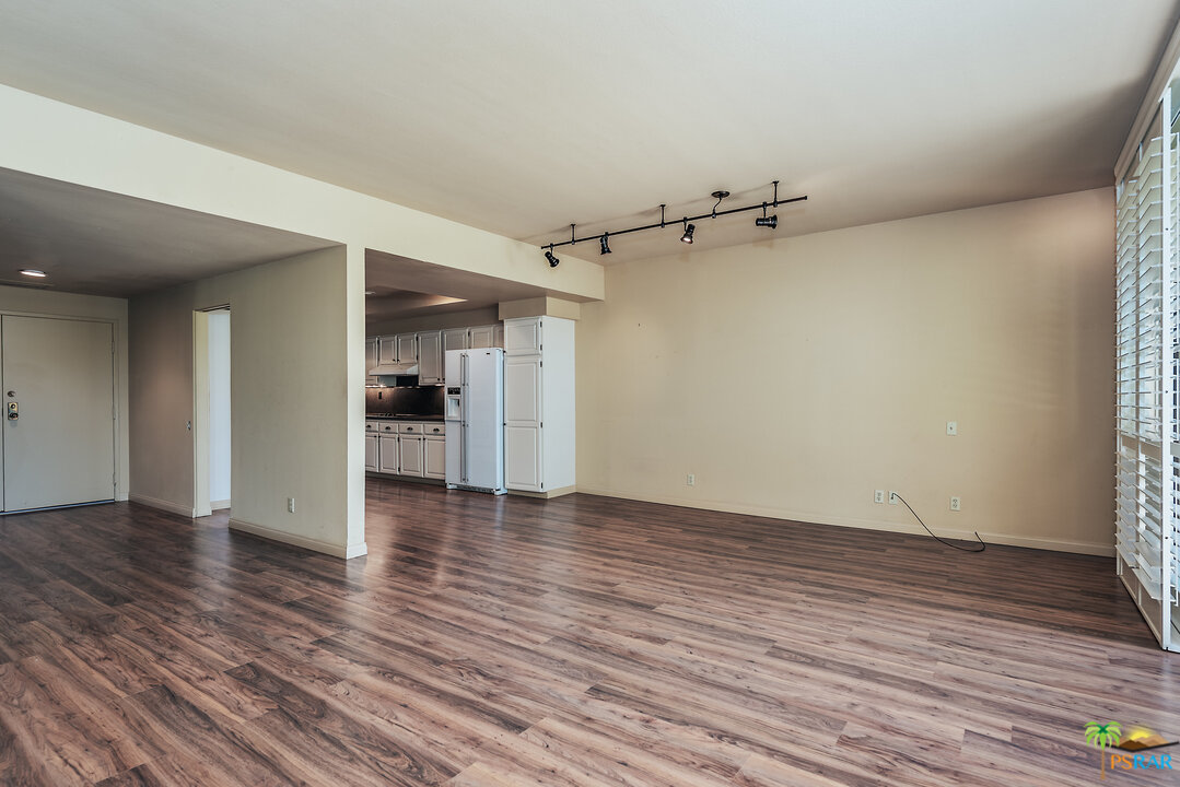 910 Island Drive, Unit 107 Rancho Mirage, CA 92270 - Photo 10 of 23 a view of empty room with wooden floor