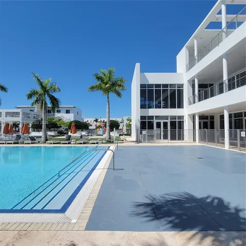 a view of swimming pool with outdoor seating