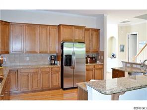 580 Quicksilver Trail Fort Mill, SC 29708 - Photo 5 of 16 a kitchen with stainless steel appliances granite countertop a refrigerator and a sink