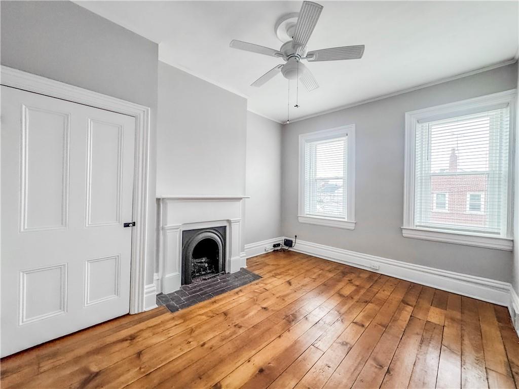 52 South 18th Street Pittsburgh, PA 15203 - Photo 13 of 26 a view of empty room with fireplace and wooden floor
