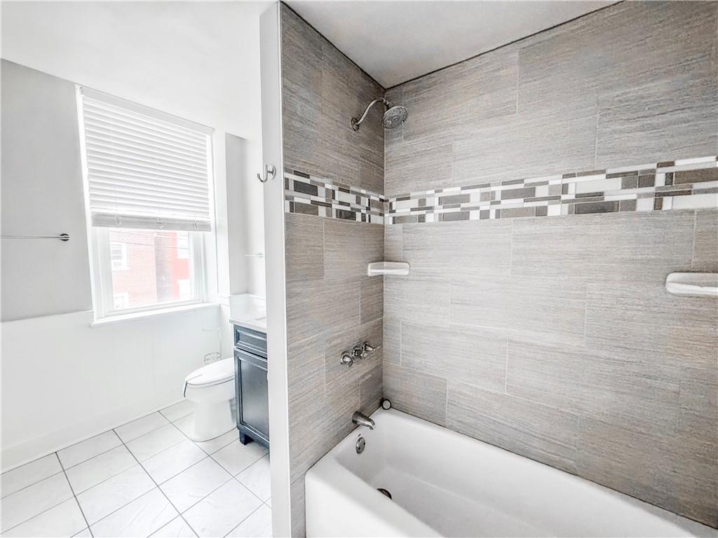 52 South 18th Street Pittsburgh, PA 15203 - Photo 15 of 26 a bathroom with a bathtub and a shower