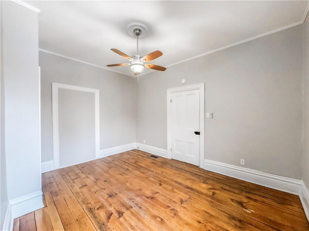 52 South 18th Street Pittsburgh, PA 15203 - Photo 16 of 26 a bedroom with a large bed and a chandelier