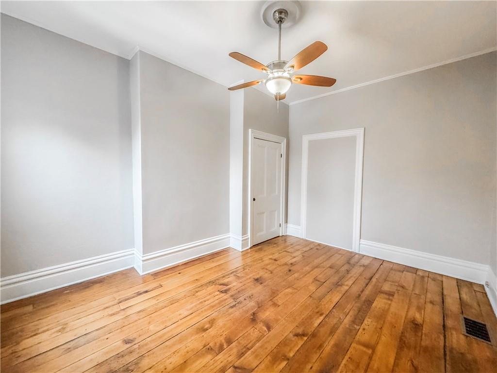 52 South 18th Street Pittsburgh, PA 15203 - Photo 18 of 26 a view of empty room with wooden floor