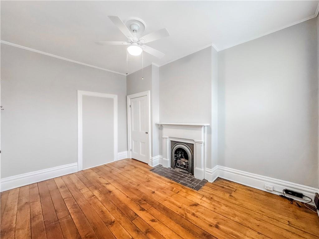 52 South 18th Street Pittsburgh, PA 15203 - Photo 21 of 26 a bedroom with a bed and a fireplace