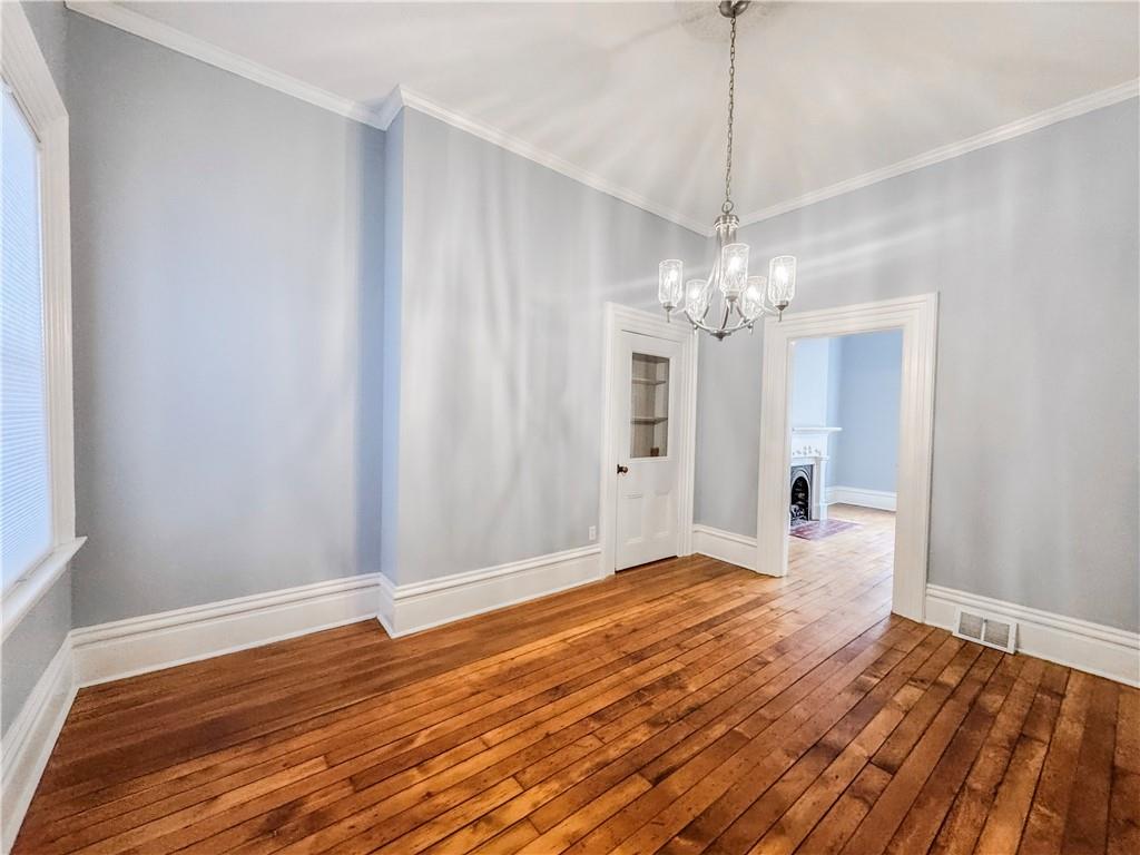 52 South 18th Street Pittsburgh, PA 15203 - Photo 8 of 26 a view of a room with wooden floor and chandelier