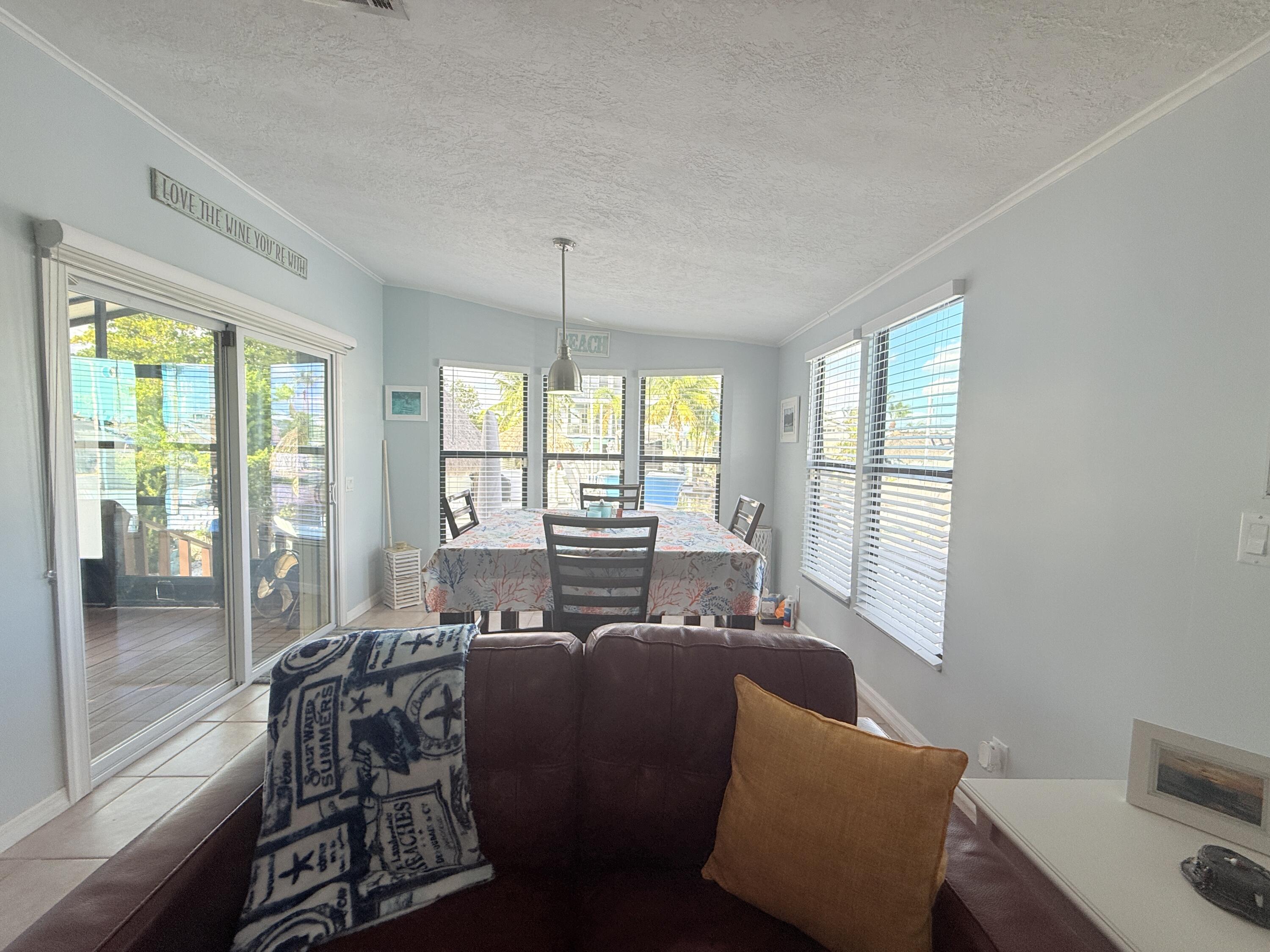 723 Boyd Drive Key Largo, FL 33037 - Photo 18 of 56 a living room with furniture and a large window