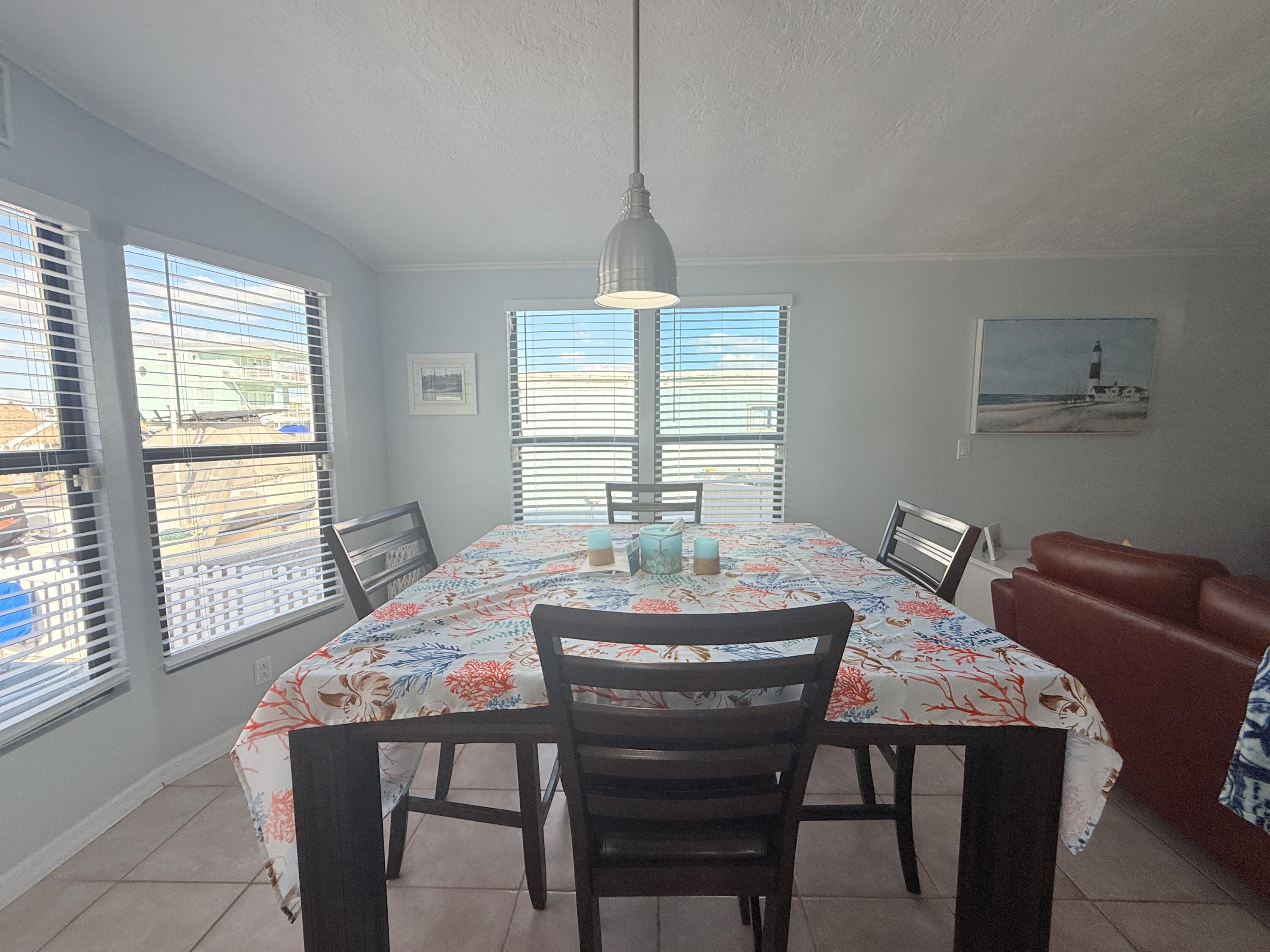 723 Boyd Drive Key Largo, FL 33037 - Photo 20 of 56 a dining room with furniture and window