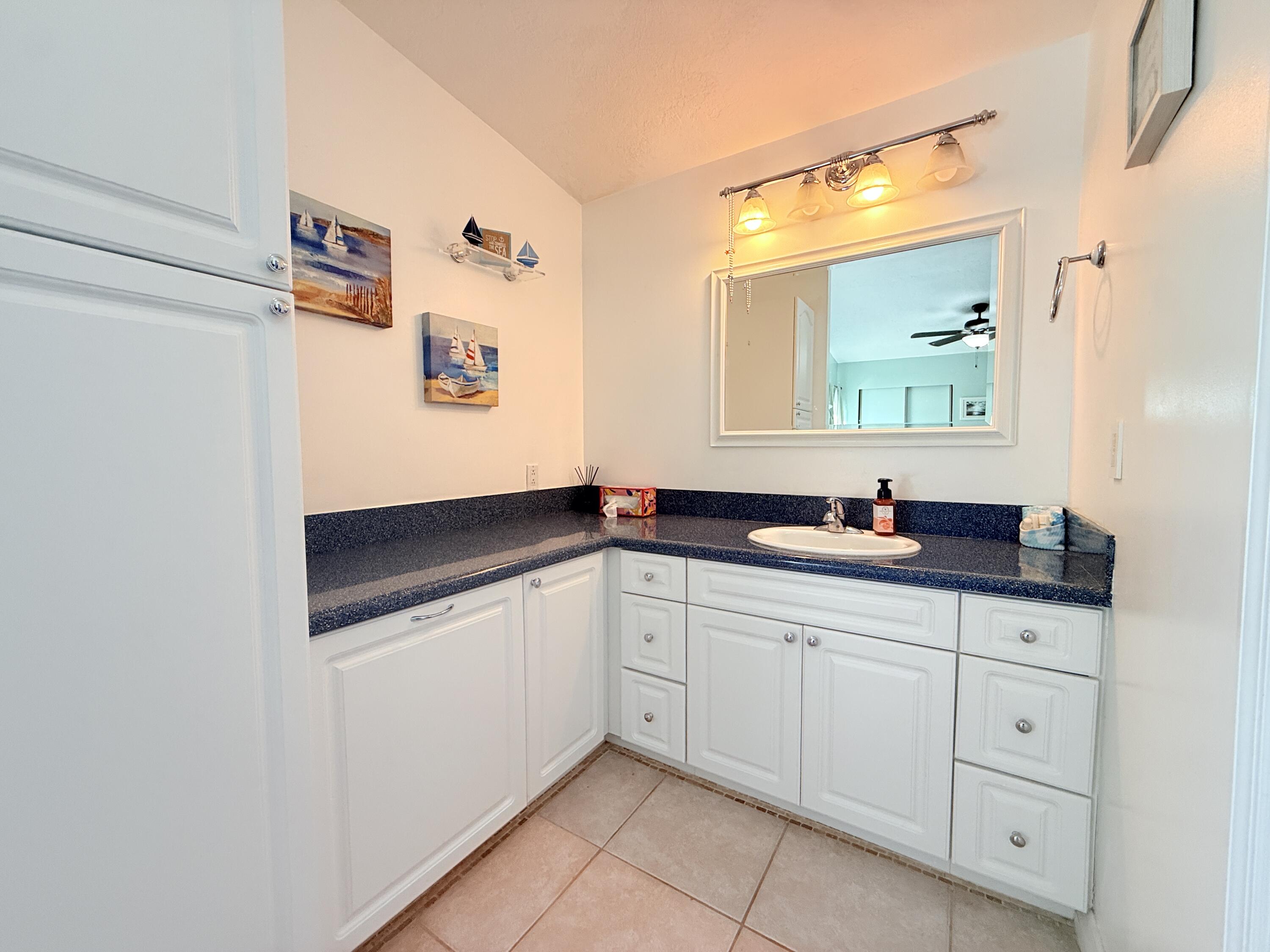723 Boyd Drive Key Largo, FL 33037 - Photo 28 of 56 a bathroom with a sink and a mirror