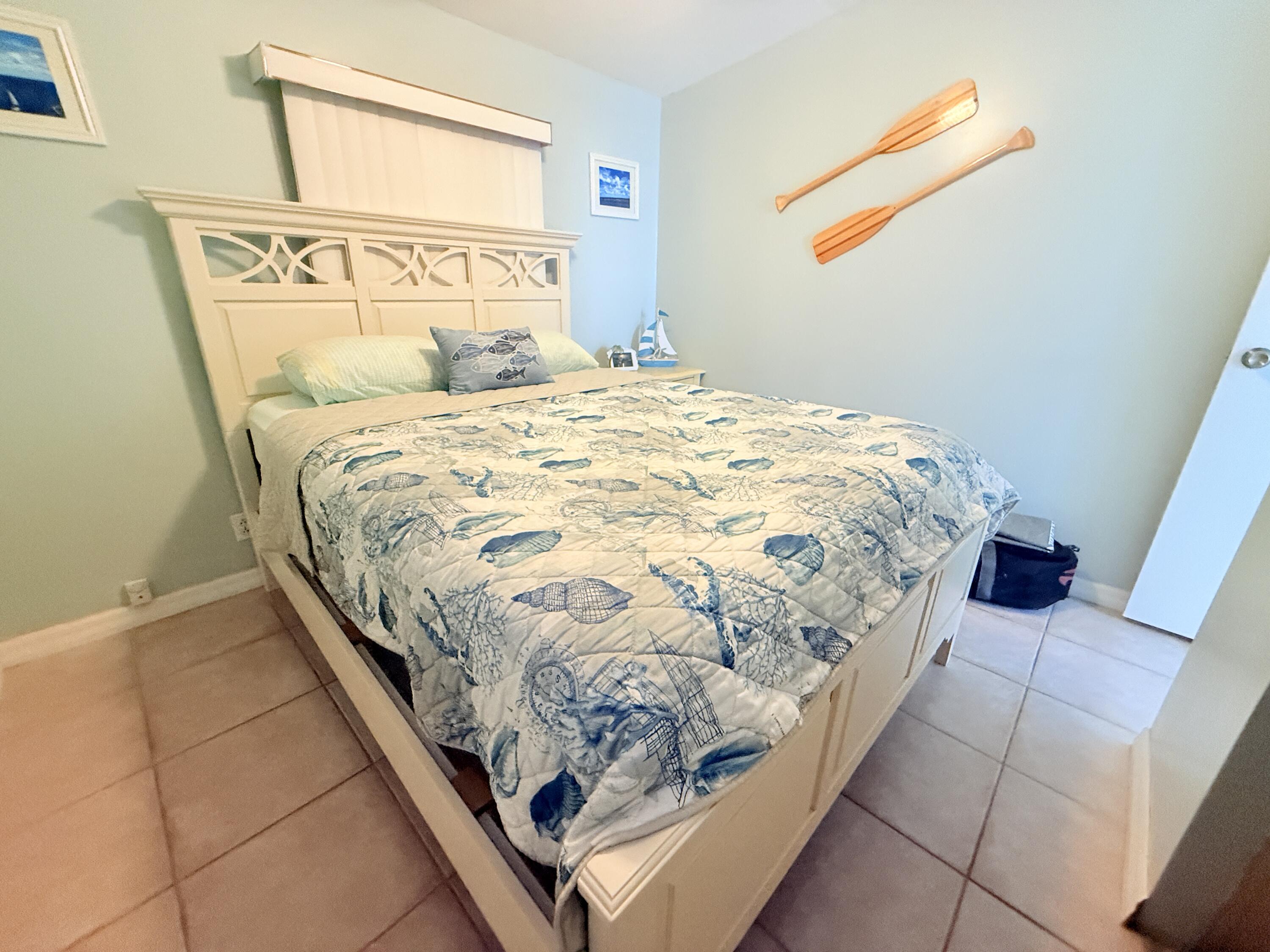 723 Boyd Drive Key Largo, FL 33037 - Photo 32 of 56 a bedroom with a bed and a window