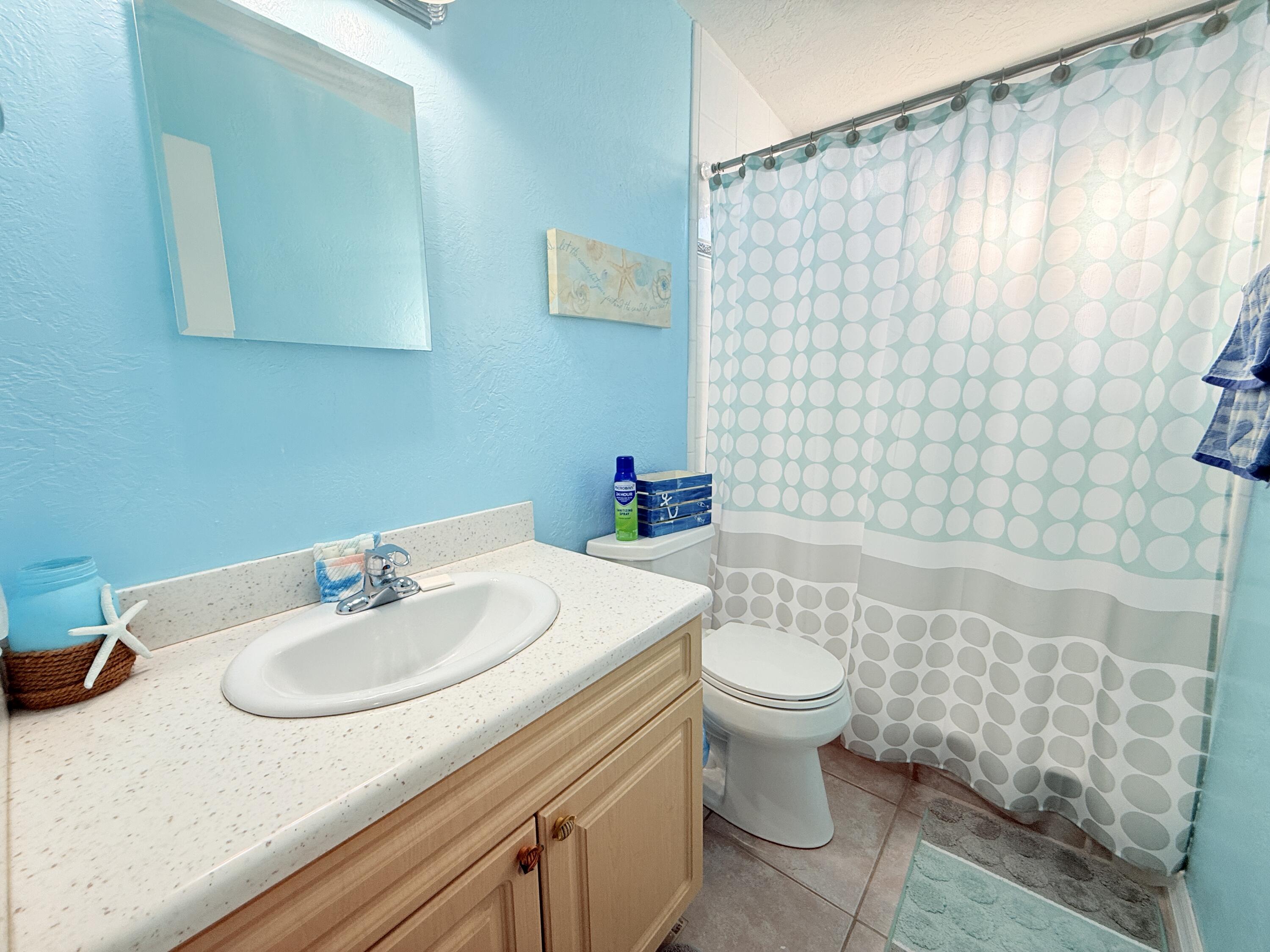 723 Boyd Drive Key Largo, FL 33037 - Photo 33 of 56 a bathroom with a sink toilet and shower