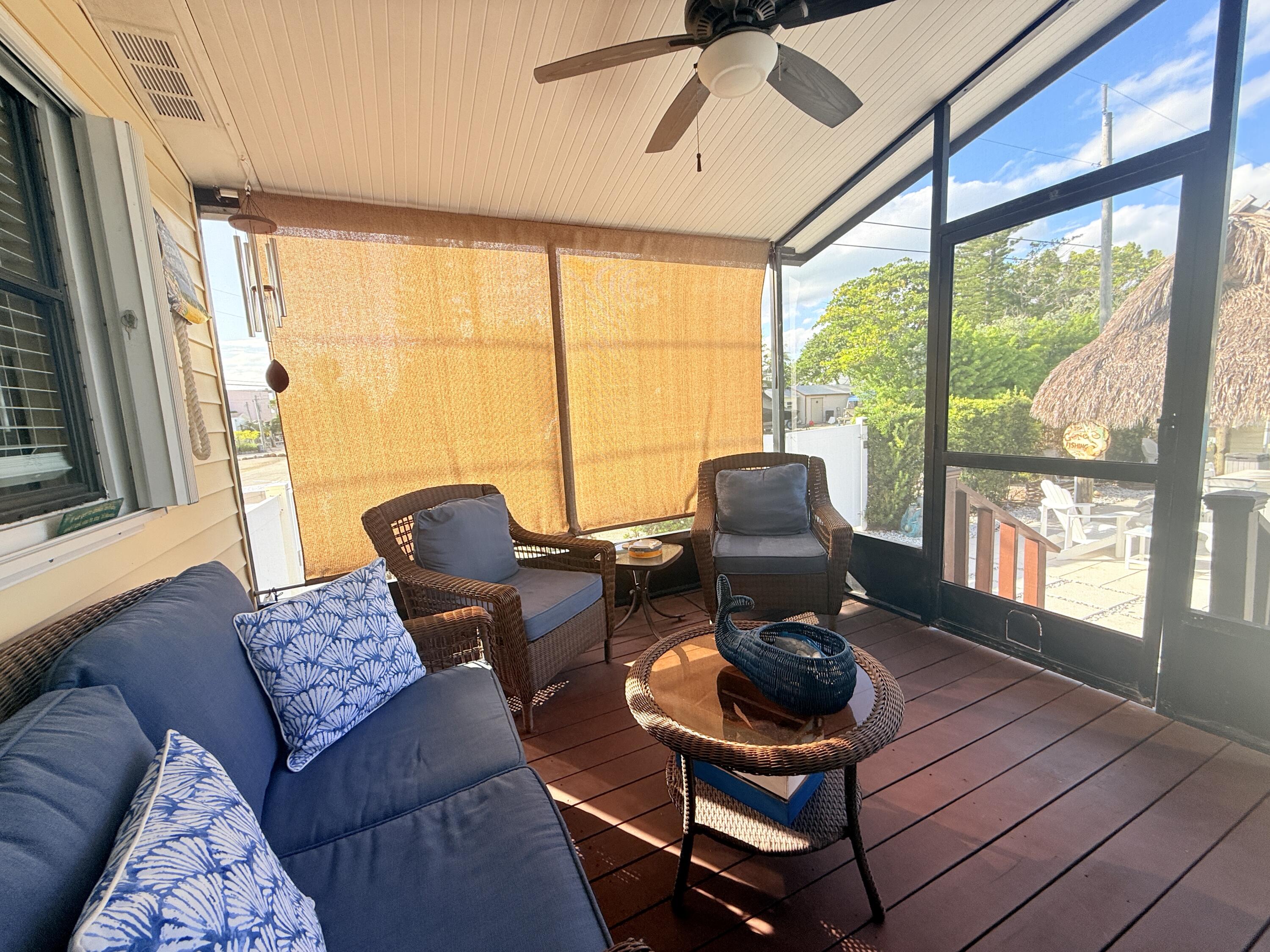 723 Boyd Drive Key Largo, FL 33037 - Photo 35 of 56 a living room with furniture and a large window