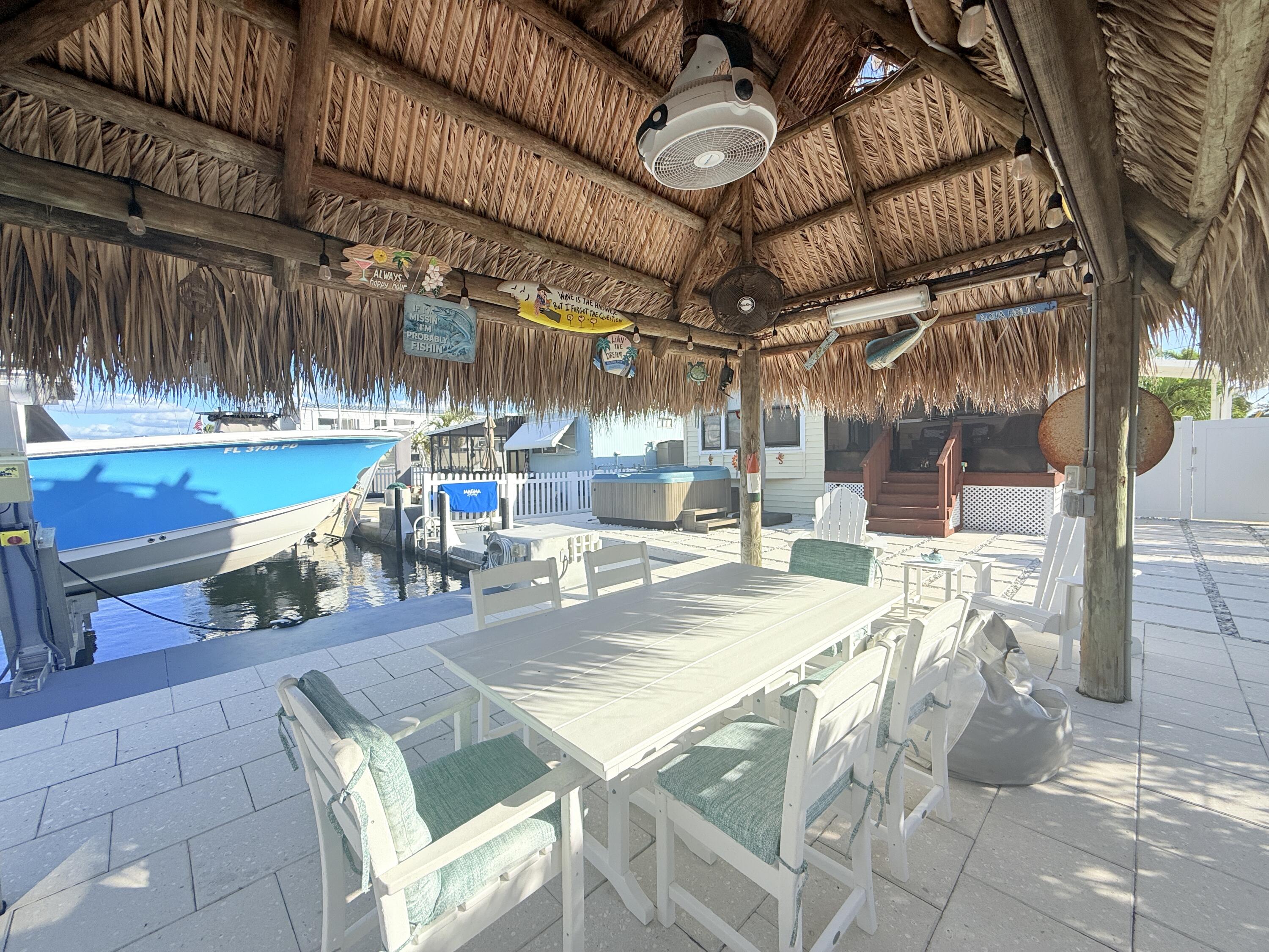 723 Boyd Drive Key Largo, FL 33037 - Photo 42 of 56 a room with lots of table and chairs