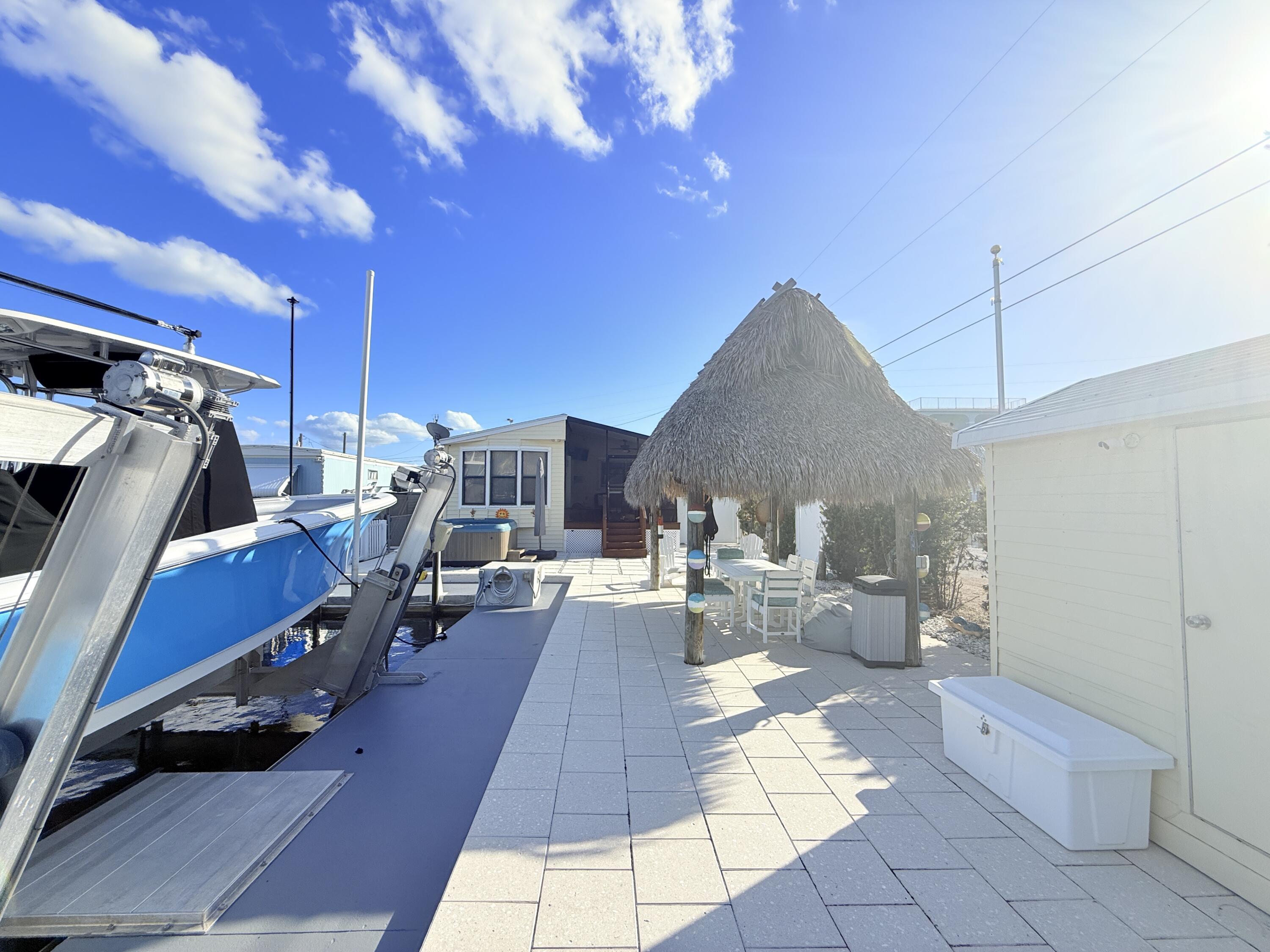 723 Boyd Drive Key Largo, FL 33037 - Photo 45 of 56 a outdoor space with lots of table and chairs
